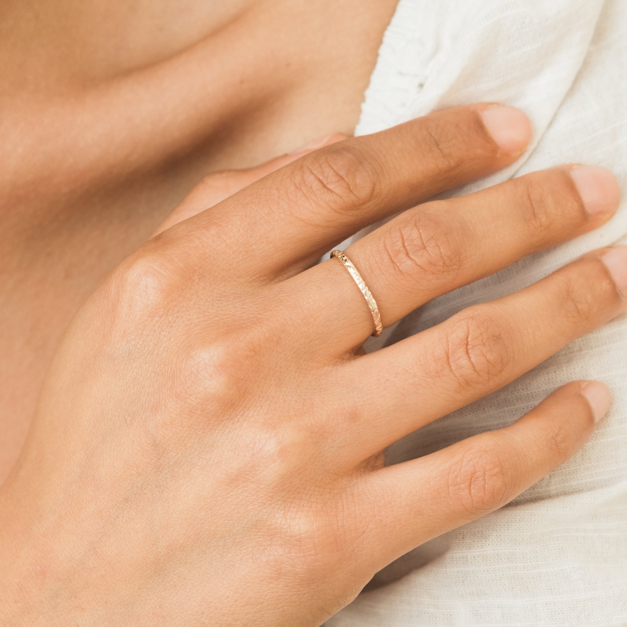 A single green leaf against a white background.