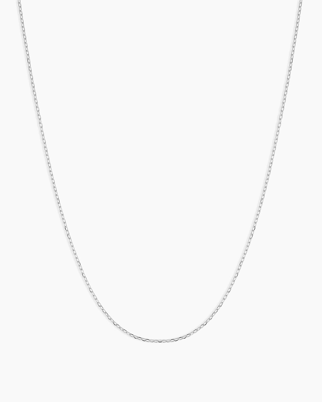 A single green leaf against a white background.